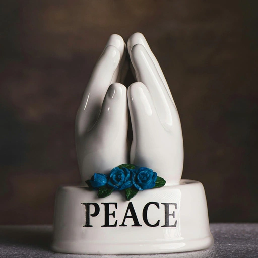 Original sculpture with PEACE text